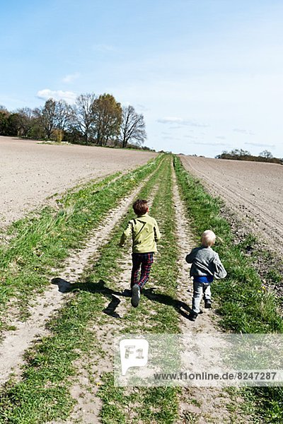 Two boys running  high angle view