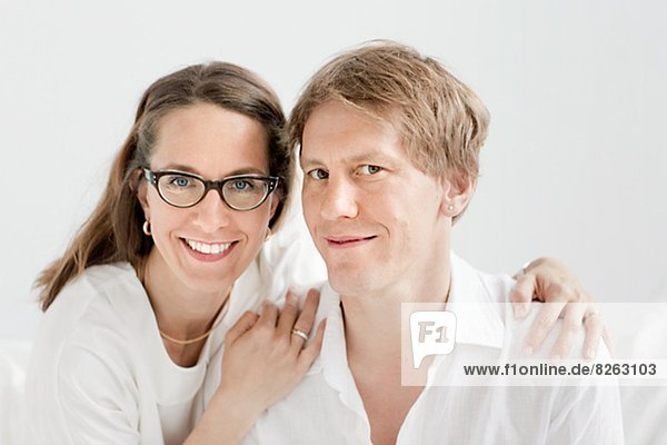 Portrait of smiling mid-adult couple  studio shot