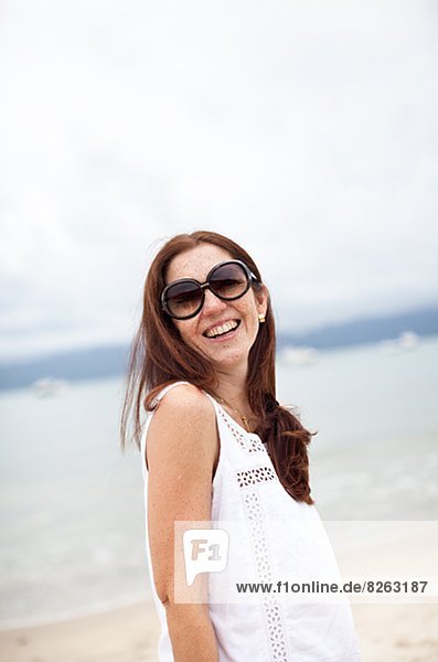 Smiling young woman on beach