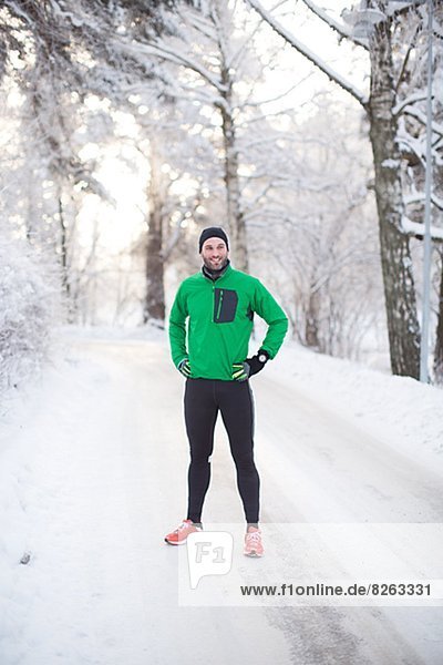 Mid adult man in sports clothes at winter