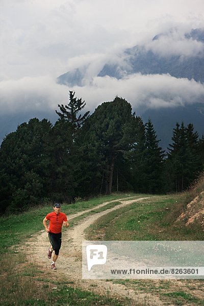 A man jogging in the mountains  Italy.