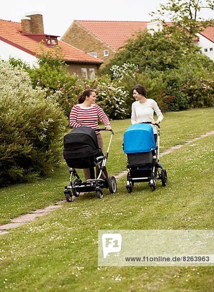 Women walking with baby carriages  Sweden.