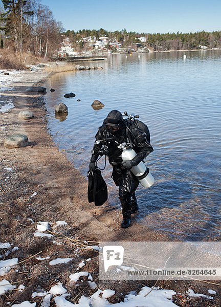 Diver walking out of water