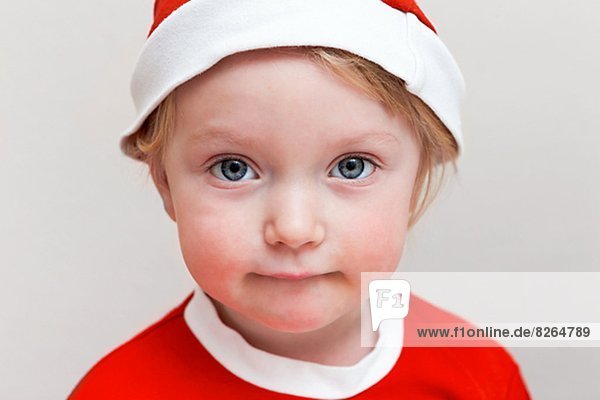 Portrait of girl wearing Santa hat