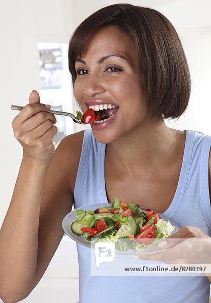 Woman Eating Mixed Salad