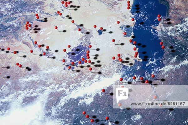Eine Satellitenansicht der Erde mit geraden Stiften an verschiedenen Stellen  digitales Composite