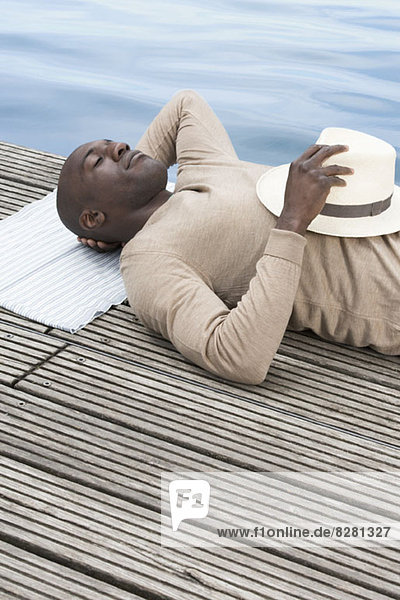 Man relaxing on decking