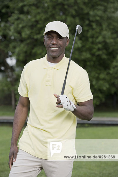 Man relaxing on golf course