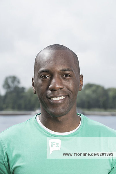 Portrait of smiling man in green t-shirt