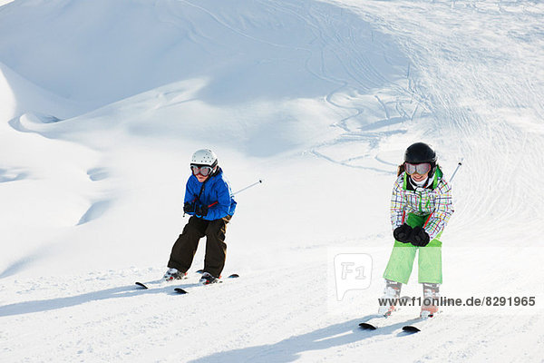 Brother and sister skiing  Les Arcs  Haute-Savoie  France