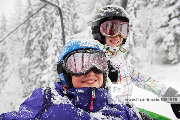 Portrait of snow covered sisters  Villaroger  Hauste Savoie  France