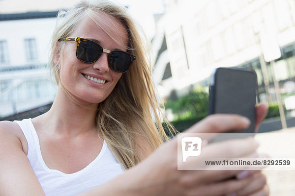 Young woman using cellular phone