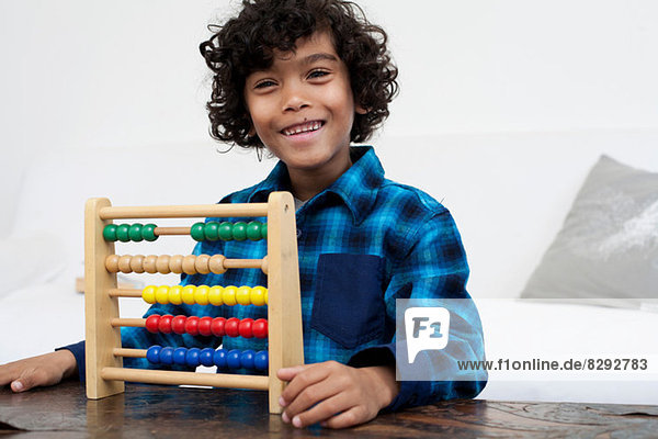 Boy playing with abacus