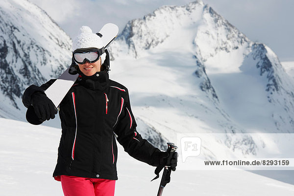 Portrait of woman holding skis  Obergurgl  Austria