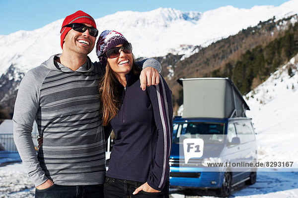 Mid adult couple with car in background  Obergurgl  Austria