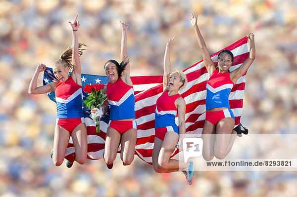 Vier amerikanische Athleten feiern