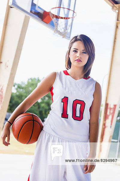 USA  Texas  American High School Girl in Sports Team Outfit with Basketball