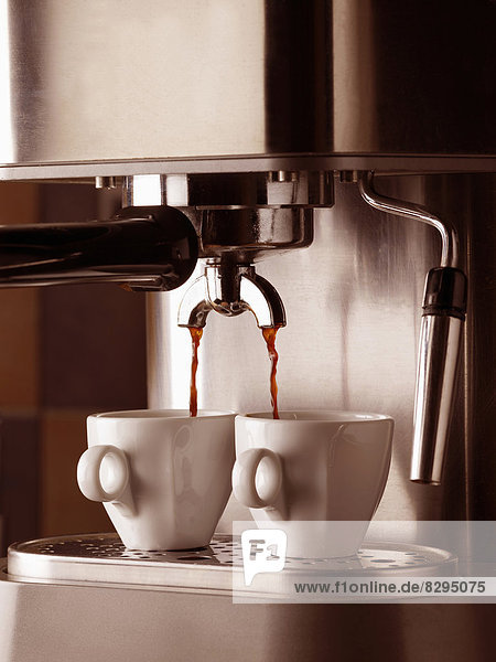 Germany  espresso machine and two cups  close-up