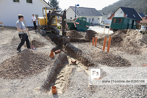 Germany  Rhineland-Palatinate  house building  earth works  laying pipes