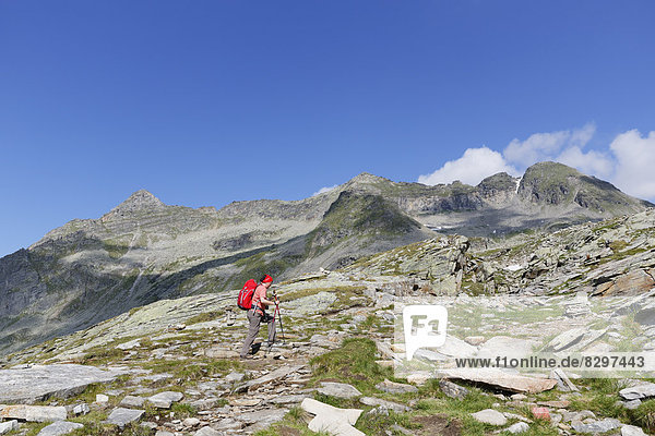 Austria  Carinthia  Obervellach  Upper Tauern  Reisseckgruppe  female hiker in front of Kammwand  Grubelwand and Riedbock