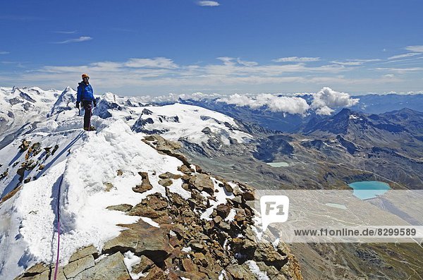 Climber on the summit of the Matterhorn  4478m  Zermatt  Valais  Swiss Alps  Switzerland  Europe