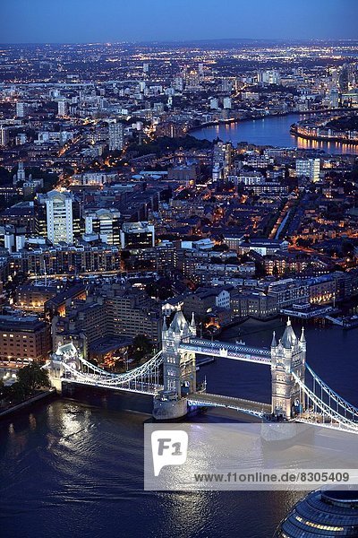 Aerial view of London at night with the Tower Bridge in the foreground  England  Great Britain  United Kingdom  Europe.