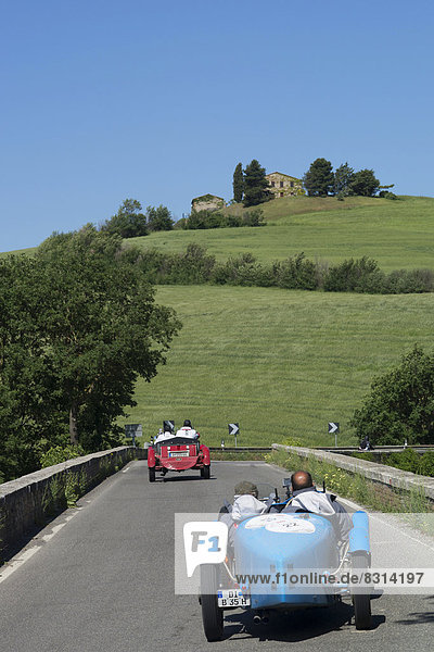 Two Bugatti convertibles  classic cars  race cars  Mille Miglia car race