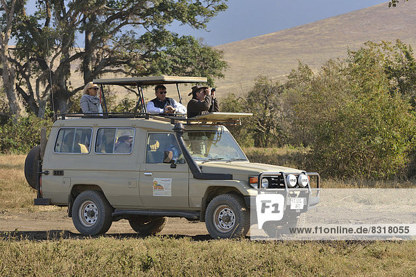 Safari vehicle travelling in the Ngorongoro Crater