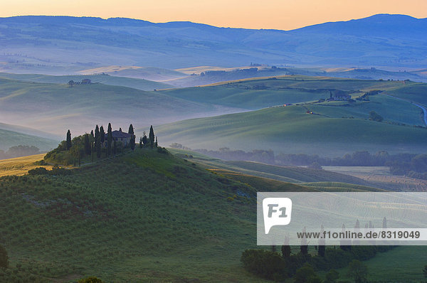 The Belvedere  morning fog  at dawn  Val d'Orcia  or Orcia Valley  UNESCO World Heritage Site