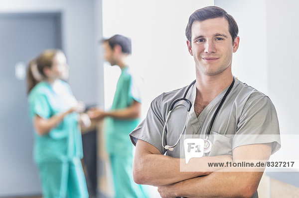 Portrait of male doctor in hospital hallway