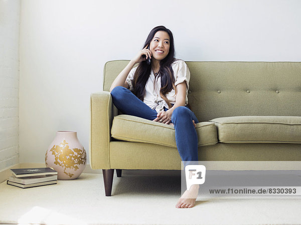 Woman sitting on sofa