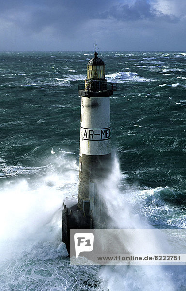Ar-Men Lighthouse  situated at one end of the Chaussée de Sein (29). Here  a wave