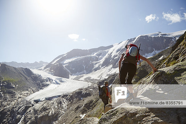 Hikers on mountain path to Taschachferner  Pitztal  Tyrol  Austria