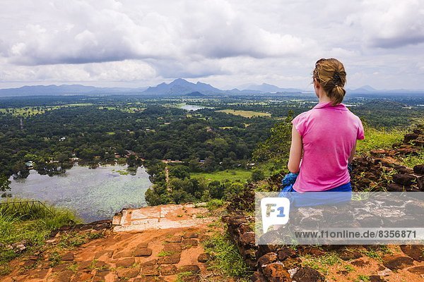 Sigiriya Rock  tourist enjoying the view over the Sri Lankan landscape  Sri Lanka  Asia