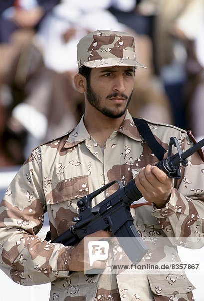 Armed solder in camouflage uniform in Abu Dhabi for celebration of 20th Anniversary of United Arab Emirates