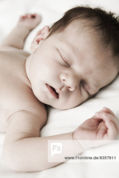 Portrait of sleeping male newborn  close-up
