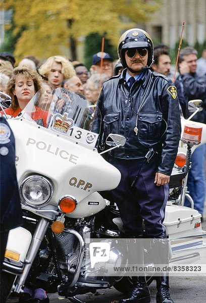 Motorcycle policeman on crowd control in Canada