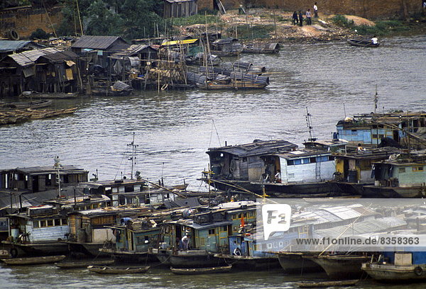 Houseboats and cargo boats on the Pearl River at Canton  China in the 1980s