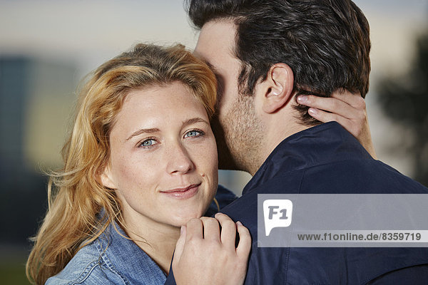 Germany  Dusseldorf  Young couple embracing