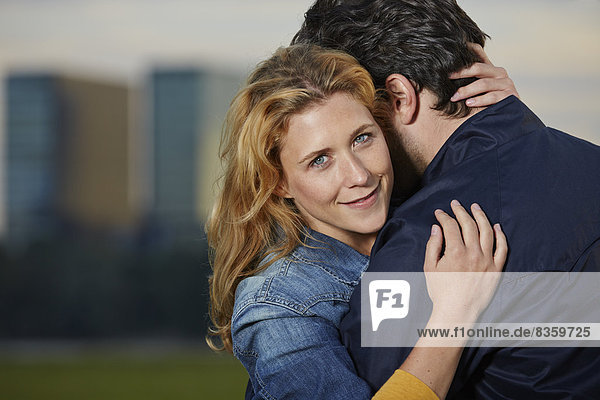 Germany  Dusseldorf  Young couple embracing