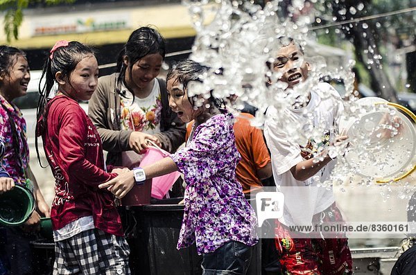 Locals celebrate Thai New Year by throwing water at one another  Songkran water festival  Chiang Mai  Thailand  Southeast Asia  Asia