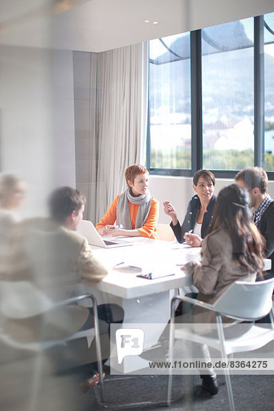 Businesspeople meeting around conference table