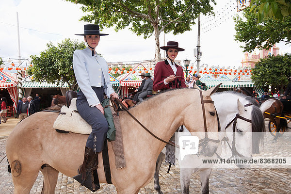 Female Horse Riders Posing During April Feria Festival Seville  Andalucia  Spain