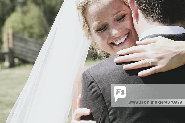 A Bride And Groom In An Embrace Pemberton  British Columbia  United States Of America