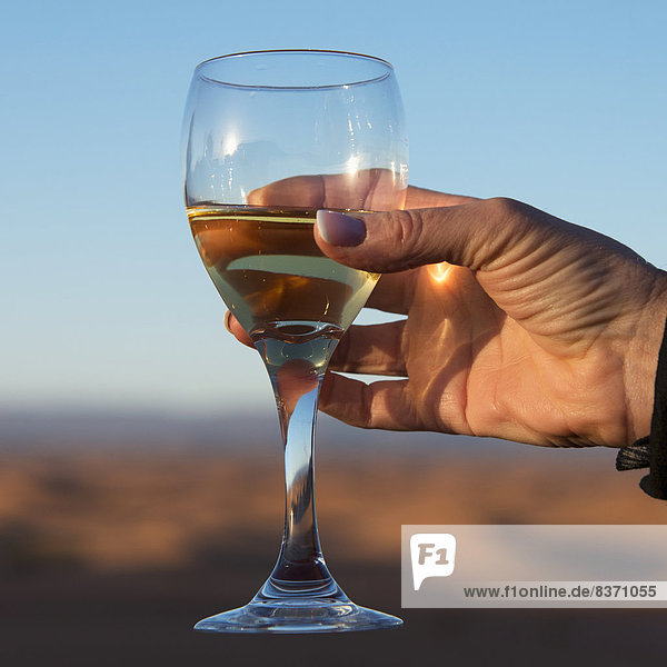 A Woman's Hand Holding A Glass Of White Wine Souss-Massa-Draa  Morocco