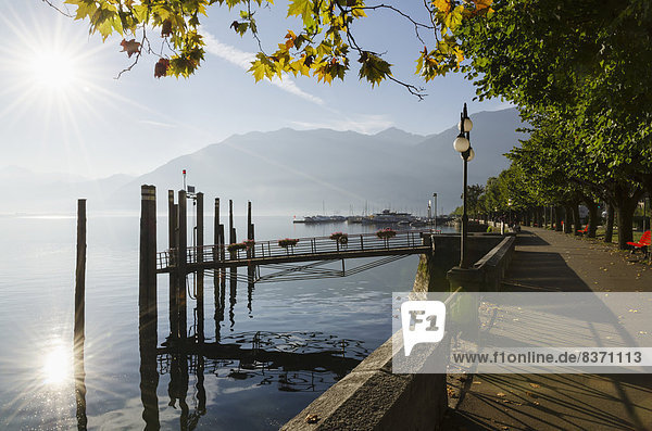Sunlight Reflecting On Lake Maggiore Beside The Promenade Locarno  Ticino  Switzerland