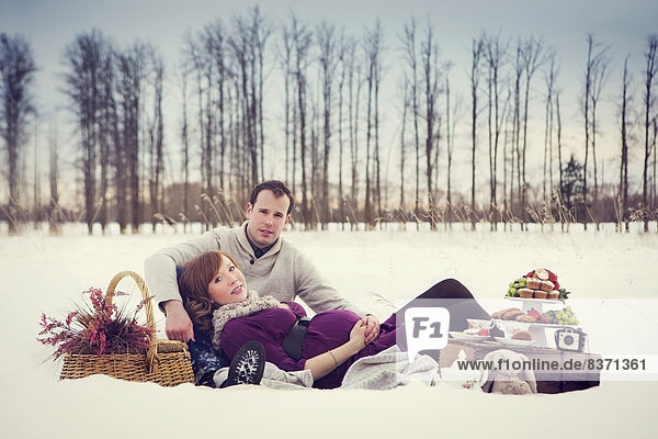 A Couple Having A Winter Picnic During Pregnancy Edmonton  Alberta  Canada