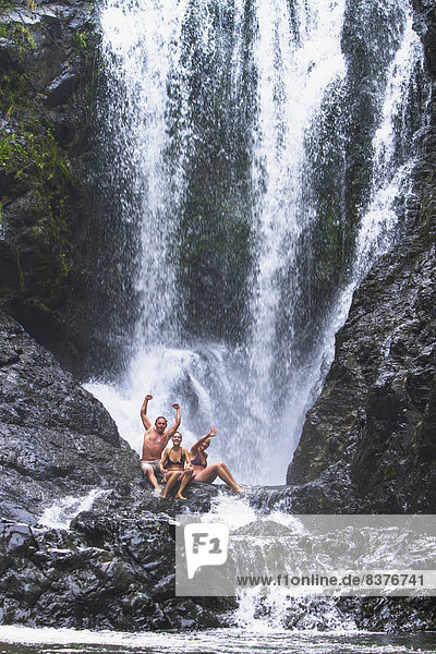 A Group Of Swimmers At Piroa Falls  Waipu  New Zealand