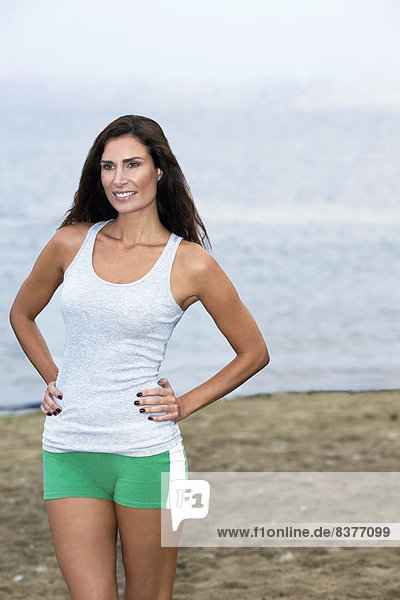 Beauty Portrait Of A Woman On A Beach In Jogging Clothes