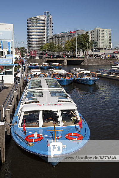 Pier  boats for canal cruises  Amsterdam  North Holland province  Netherlands